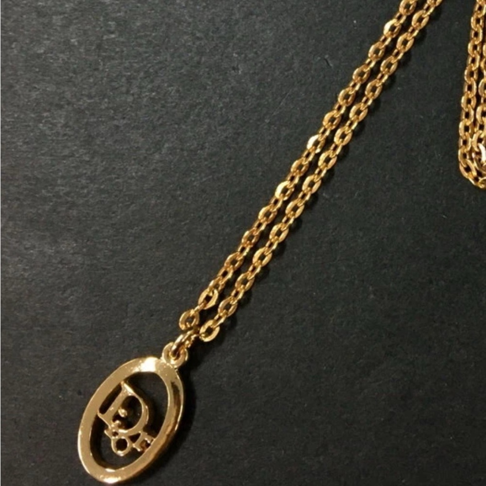 Christian Dior Logo Gold tonePendant Necklace.